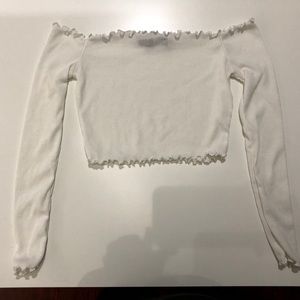 Frilly cropped white long sleeved top